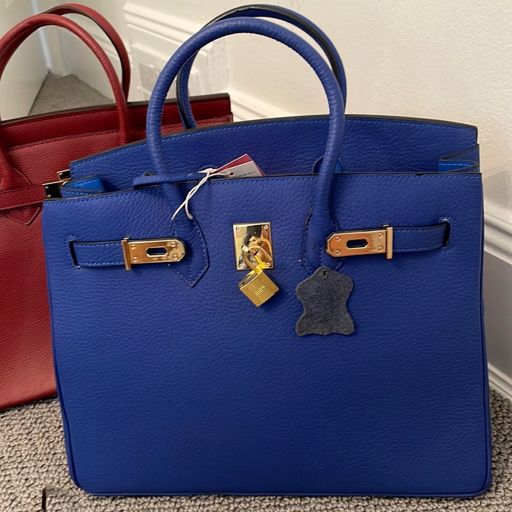 Handbag blue with gold hardware. Brand new